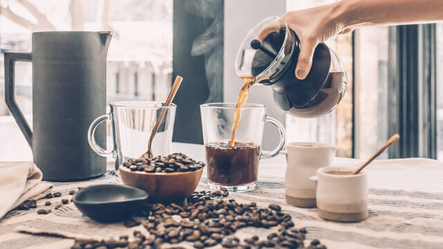 Coffee beans in hand grinder